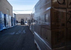 A forklift driver carefully stacks boxes of shelf-stable food outside The ActionCenter warehouse in Lakewood, Colorado. The boxes are part of a 50-ton donation made to the non-profit community organization by the Latter-day Saints Charities.